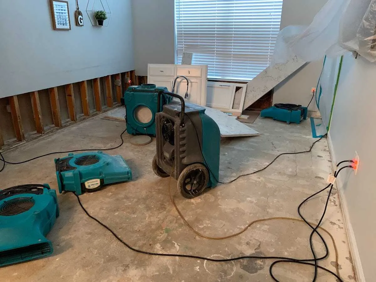 Dehumidifier in flood-cut room for Water Damage Restoration in Weiser